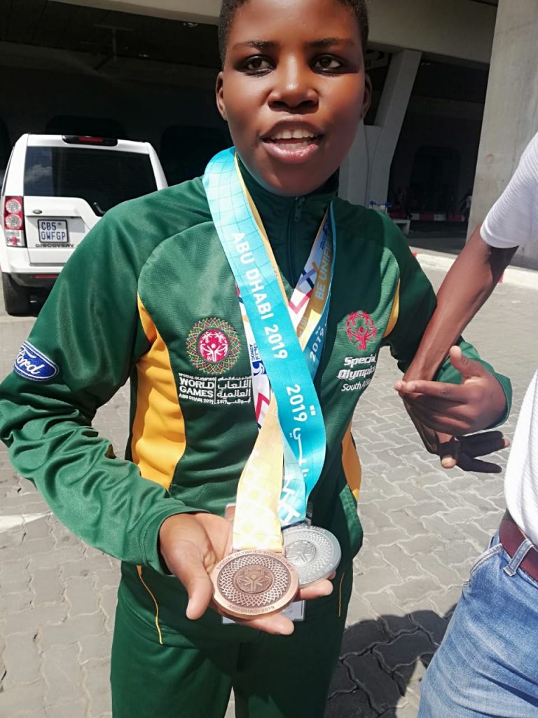 Gopolang Mogale showing off her medals.jpeg