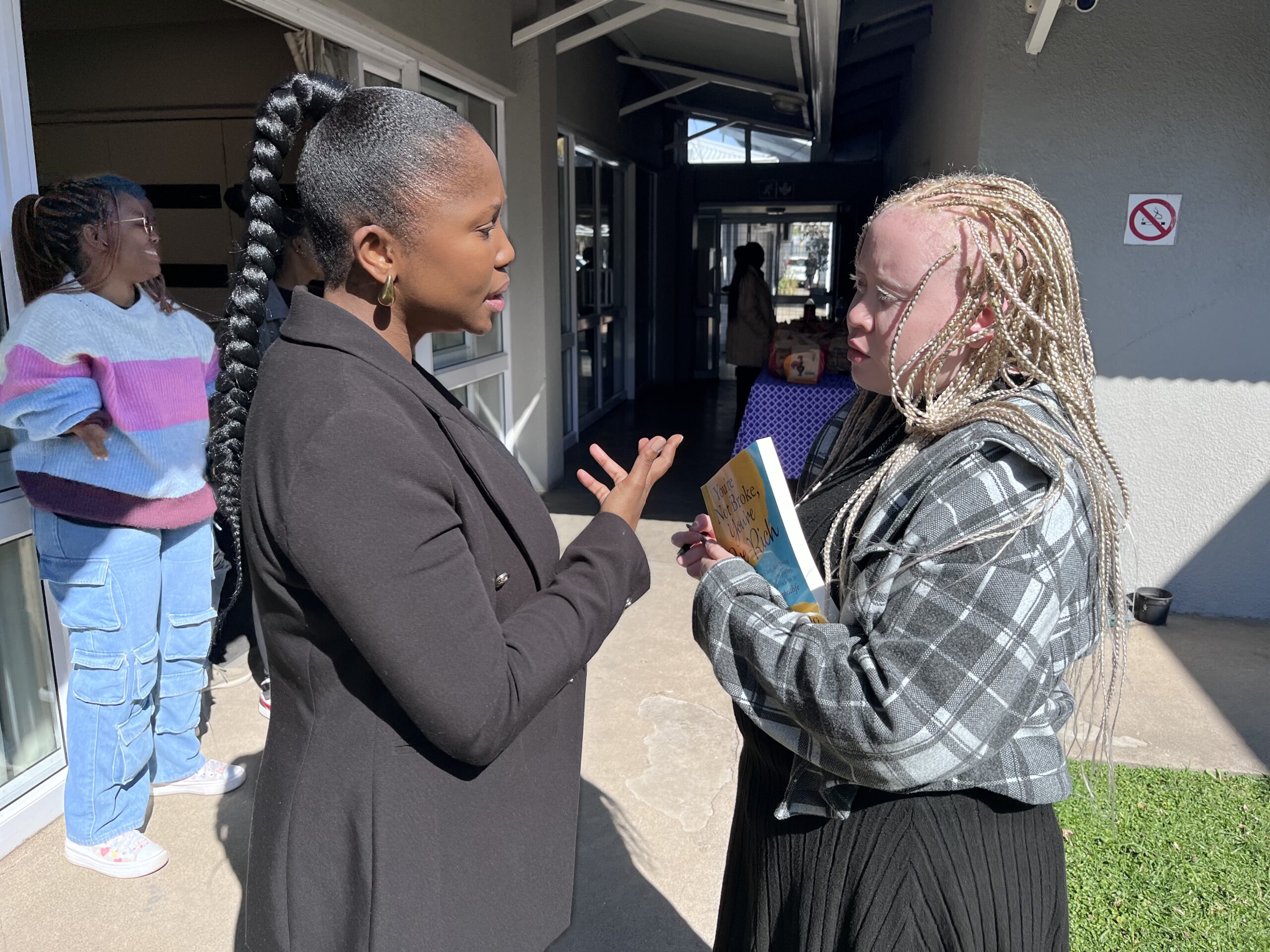 Lallie Kibido chats to facilitator Mapalo Makhu after the financial literacy training