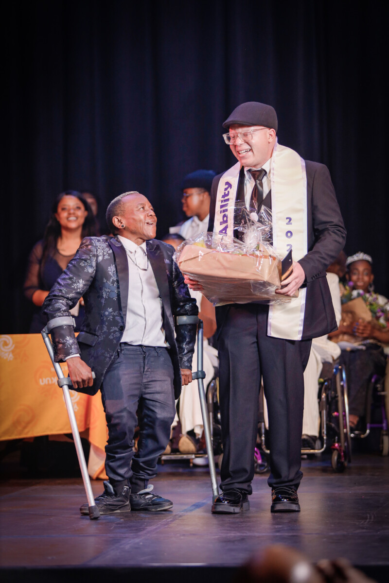 King of the Pageant- Koketso Makakane with Judge Hloni Babedi at the Afrika Tikkun's pageant