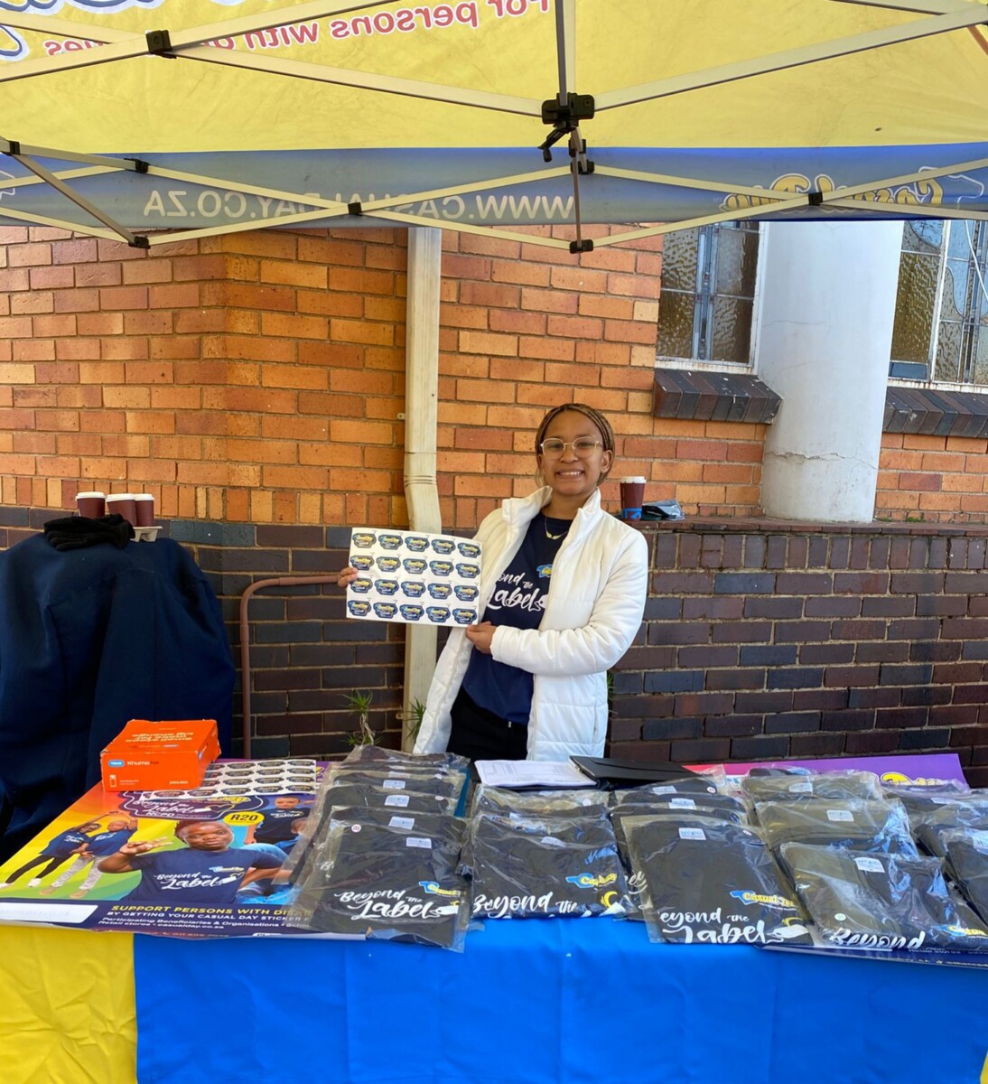NCPD's Ronel Minnies proudly mans the Casual Day 2025 stand at the Melville Church Bazaar