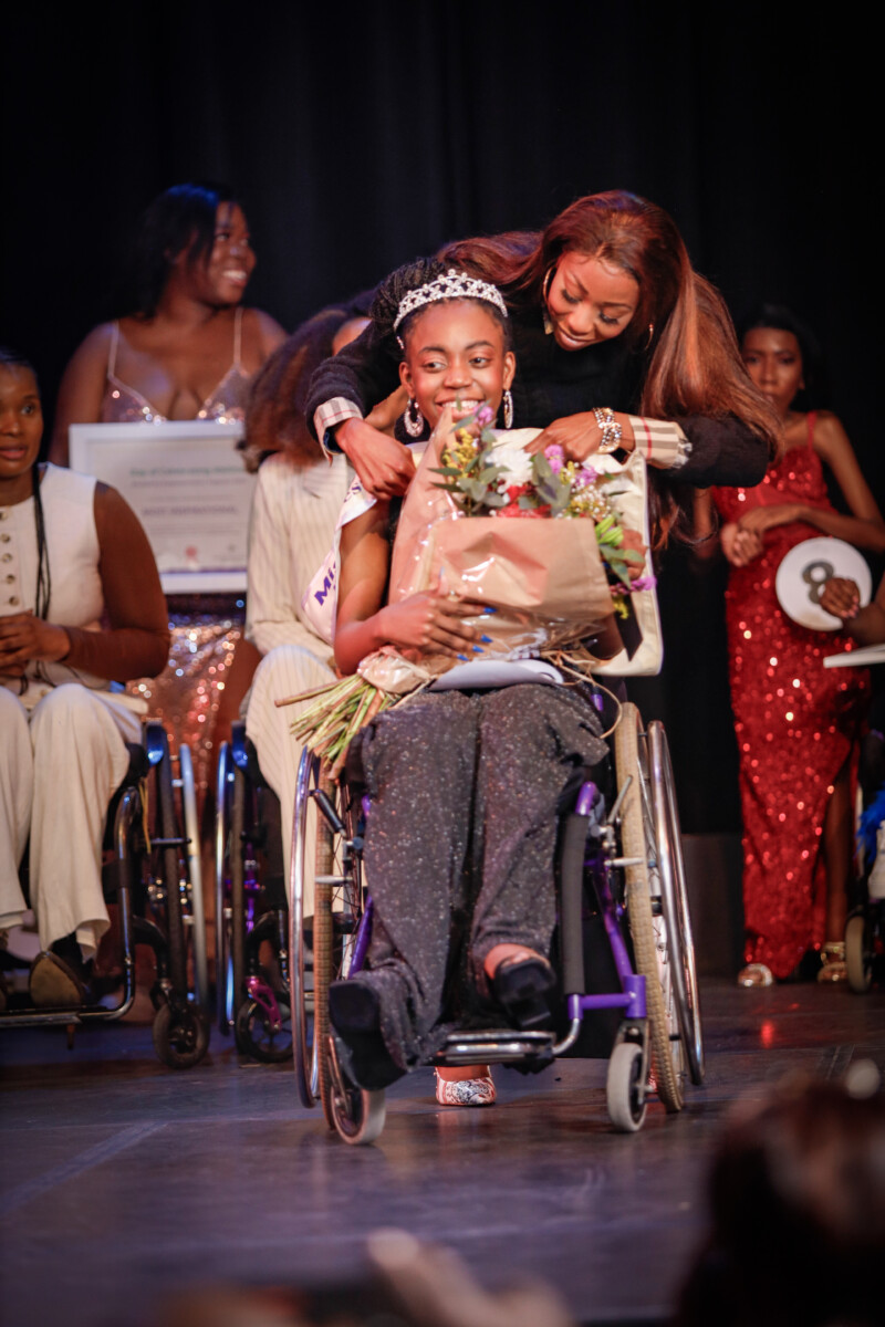 Afrika Tikkun's pageant Princess, Owami Joaquim with judge , Faith Mangope
