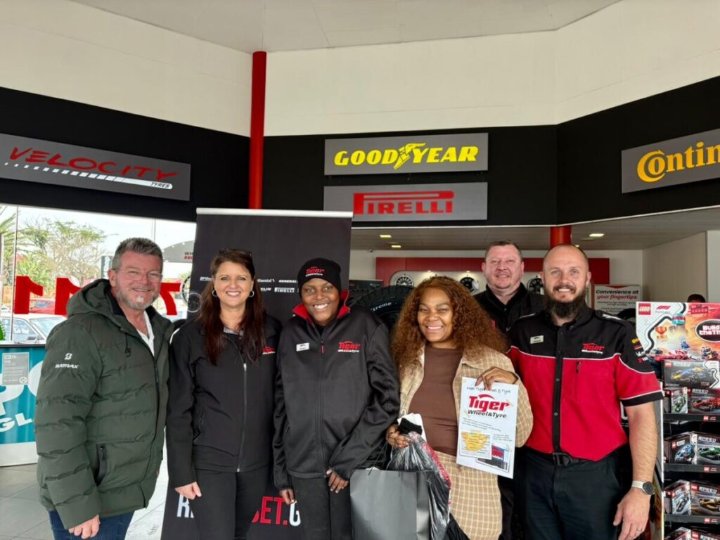 Autism Activist, Nkazimulo Mngomezulu flanked by staff members from Key West Tiger Wheel and Tyres