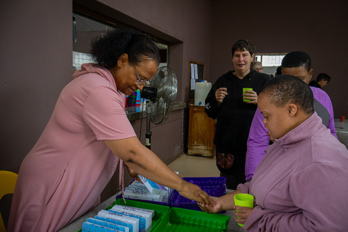 Barbara Weale administering medication to the residents of the APD Limpopo community