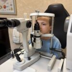 A child undergoes a digital eye-tracking assessment