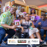 Gugu Mjilo and Musa E. Zulu (both on wheelchairs) flanked by guests during the book launch tour
