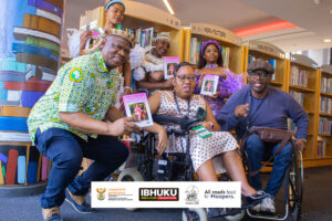 Gugu Mjilo and Musa E. Zulu (both on wheelchairs) flanked by guests during the book launch tour